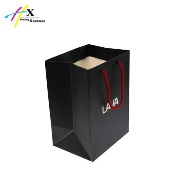 Black paper bag with white logo both sides 