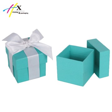 fancy blue paper gift box with ribbon closure