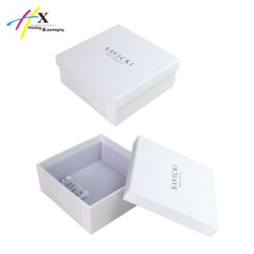 small white rigid paper jewelry box