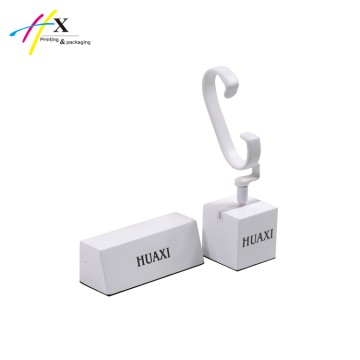 white matte finish single watch stand and logo stand