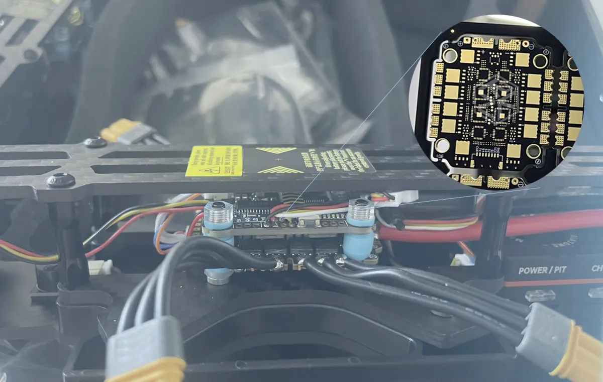 Close-up of a high-performance ESC PCB for drones showing MOSFETs, MCU, and capacitors