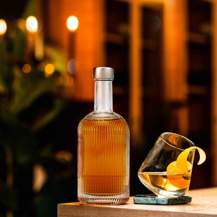 Customized Embossed Design Wholesale 700ml Round Shape Glass Spirit Bottles
