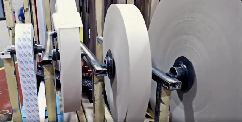 Process of making paper ribbons for paper tube production.
