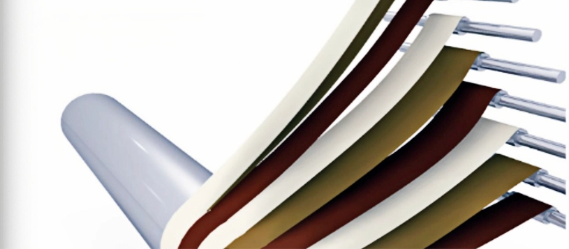 Winding paper ribbons around a mandrel to form paper tubes.