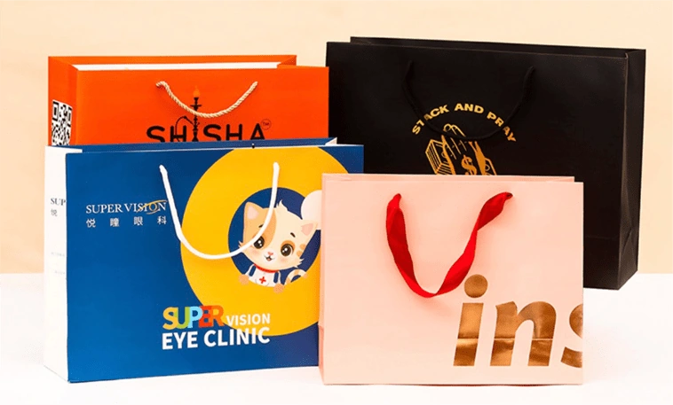 Coated paper gift bags with vibrant color printing, ideal for marketing events and custom paper bags.