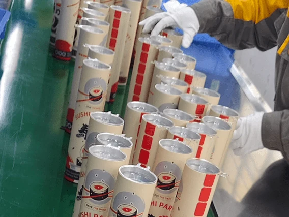 Sushi push pop cardboard tube packaging in factory production.